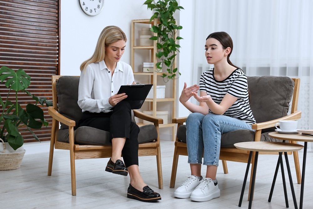Teen Receiving Individualized Mental Health Counseling From a Therapist in a Comfortable, Supportive Setting