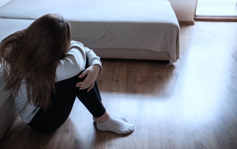 Female teen depressed thinking of self-harm